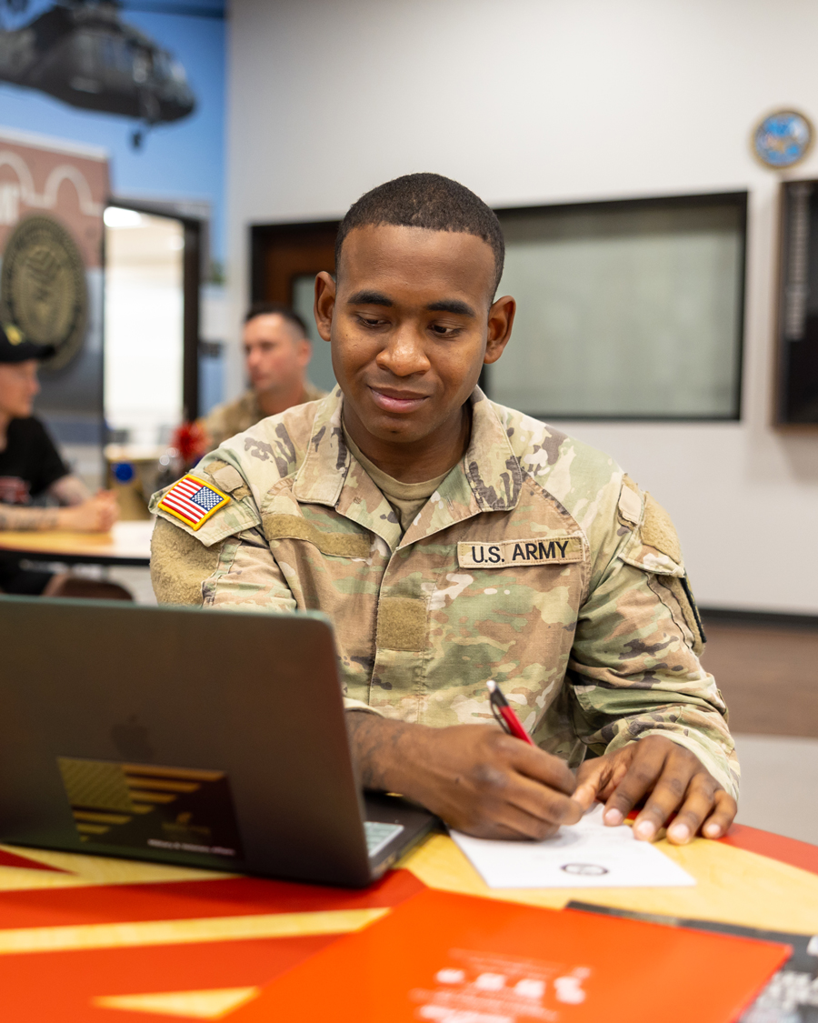 Military Student working on their laptop