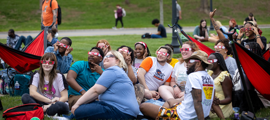 Students on the lawn during solar eclipse