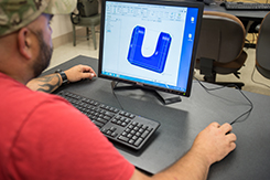 Student works on CAD program in Fort Campbell campus lab