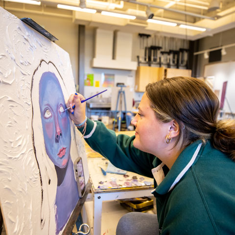 Student working on an art piece
