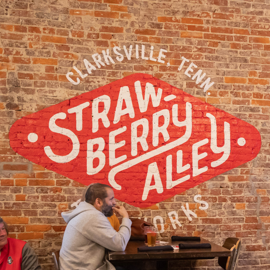 wall painting of the Strawberry Alley logo
