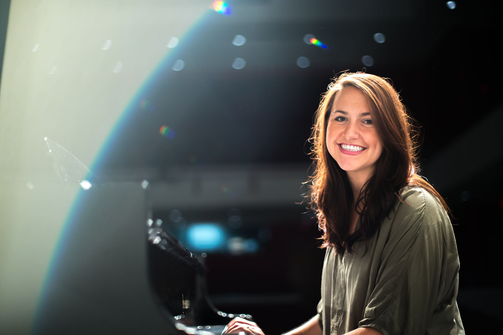 Susannah White poses for photo at MMC concert hall piano