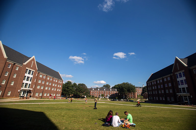 Students sitting on the grass in the Quad