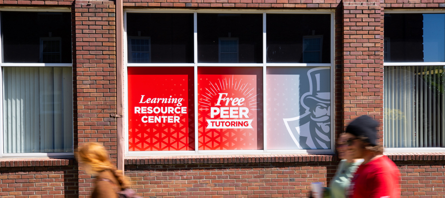 Window Sign that says Learning Resource Center Free Peer Tutoring