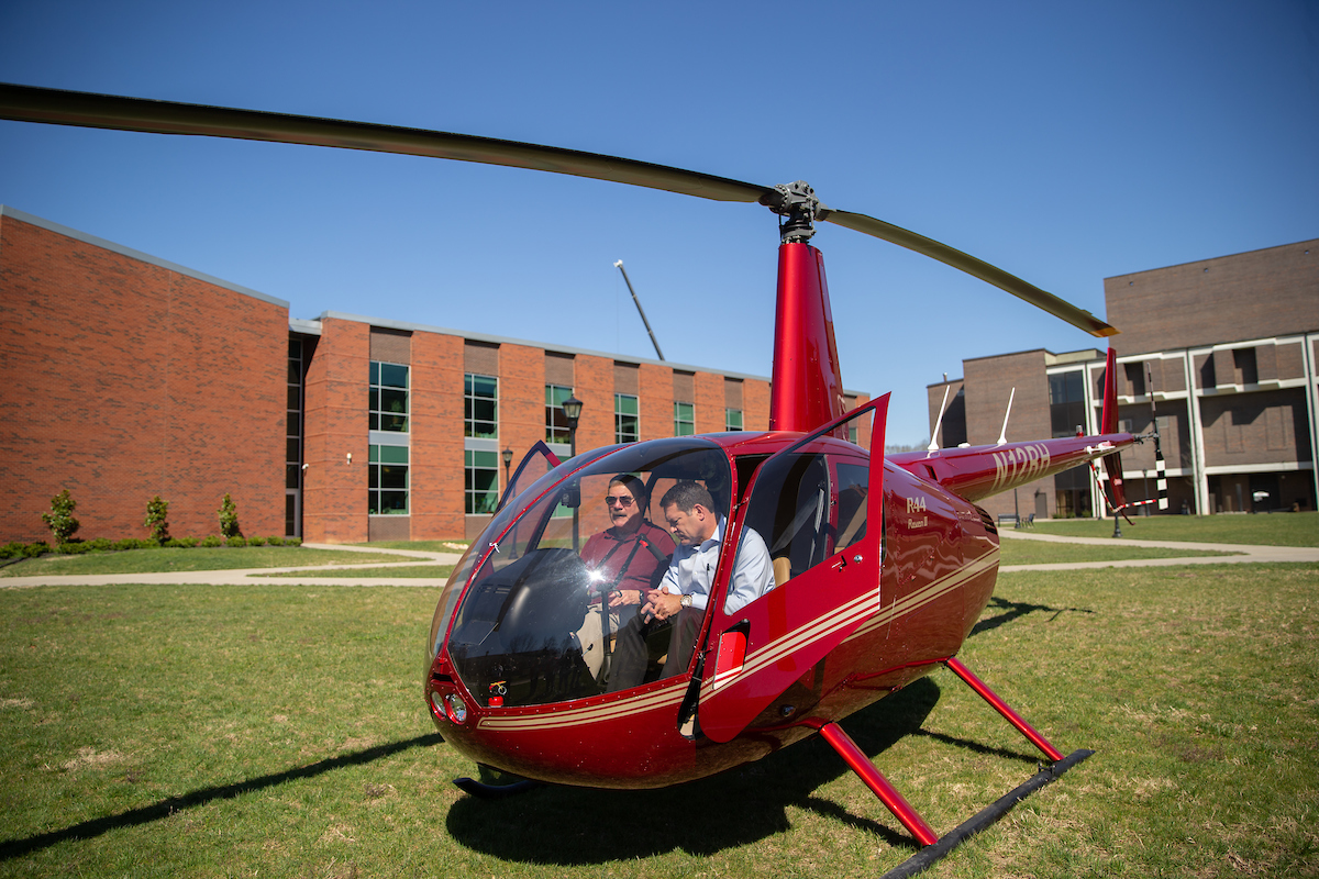 Aviation science program director and chief pilot Charlie Weigandt shows GOV 3 to U.S. Rep. Mark Green. GOV 3 is one of three in APSU's helicopter fleet.