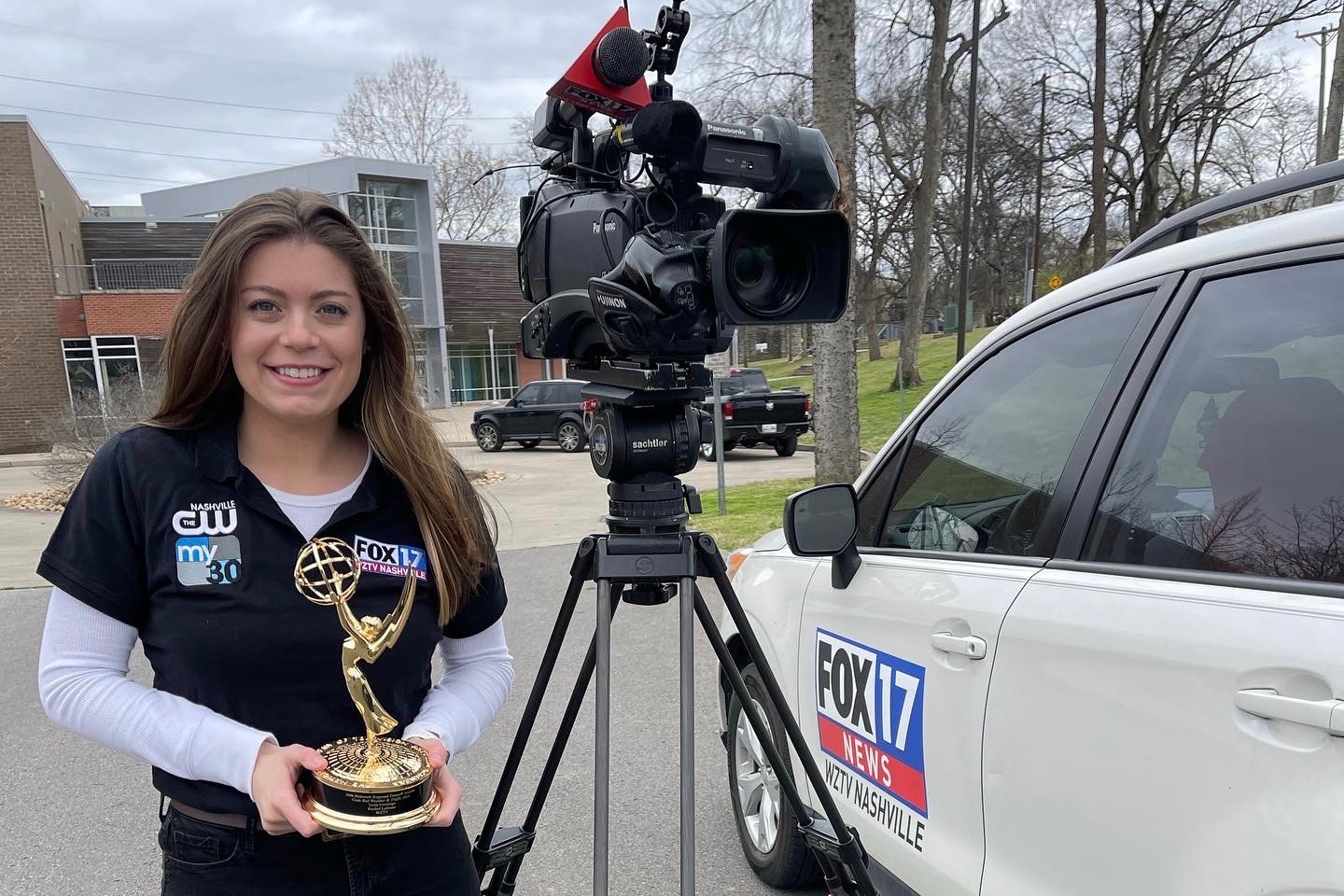 Rachel LeJeune holding a News Emmy
