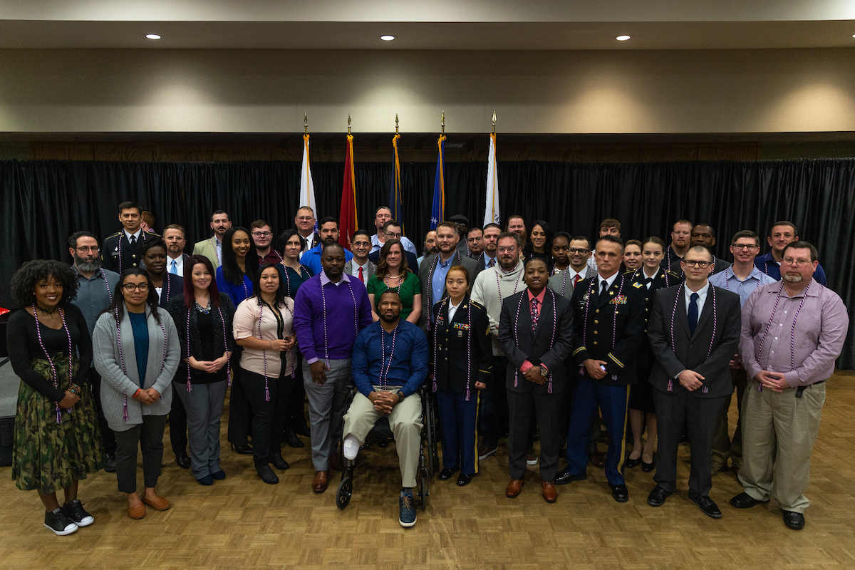 Military graduates earn a specially designed coin and cords from Austin Peay in addition to their degrees. Pictured are the December 2018 honorees. 