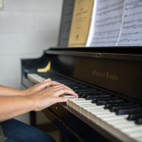 Student playing the piano