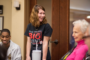 Student engaging with residents at a senior home.