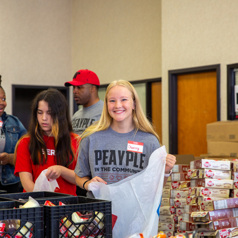 APSU Peayple helping pack bags with supplies
