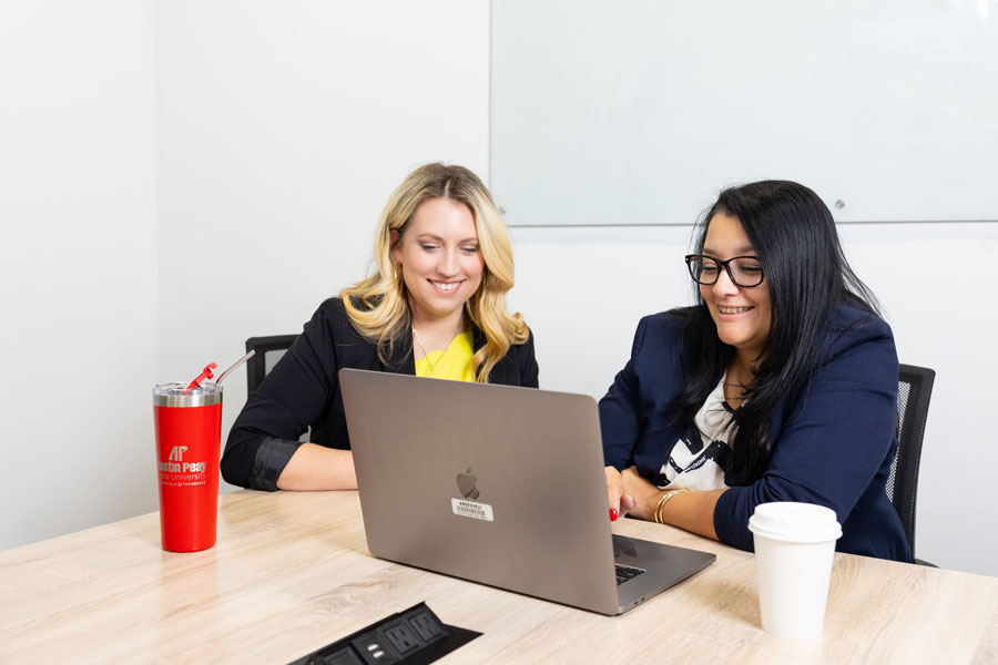 students looking at a laptop