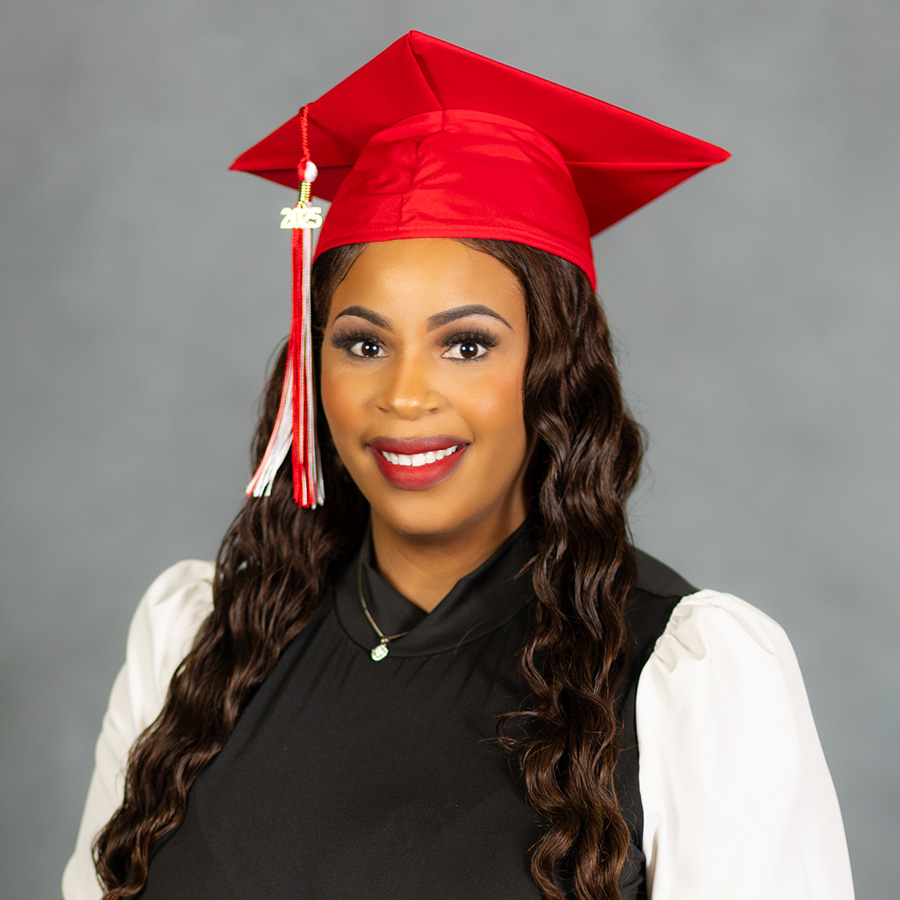 Headshot of woman wearing her graduation cap.