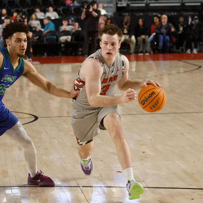 Player dribbling the ball past a defender