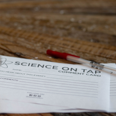 Science on tap comment card laying on a table