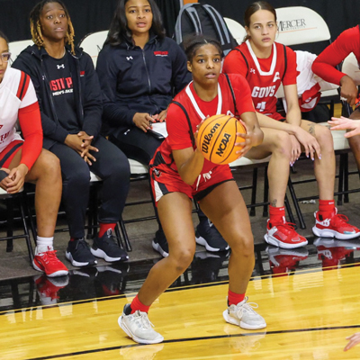 Player getting ready to shoot a 3 point from the side. 