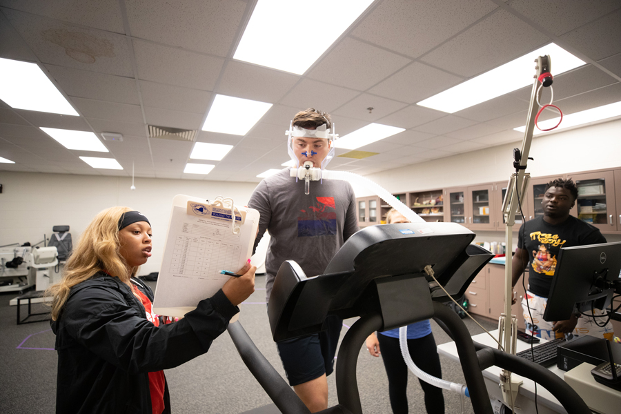student being shown results while running on a treadmill