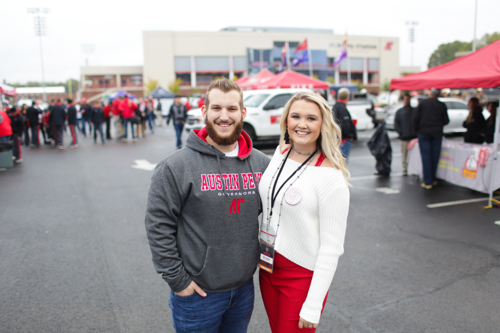 Students pose for photo in Tailgate Alley