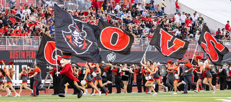 The Color guard running onto the field with flags