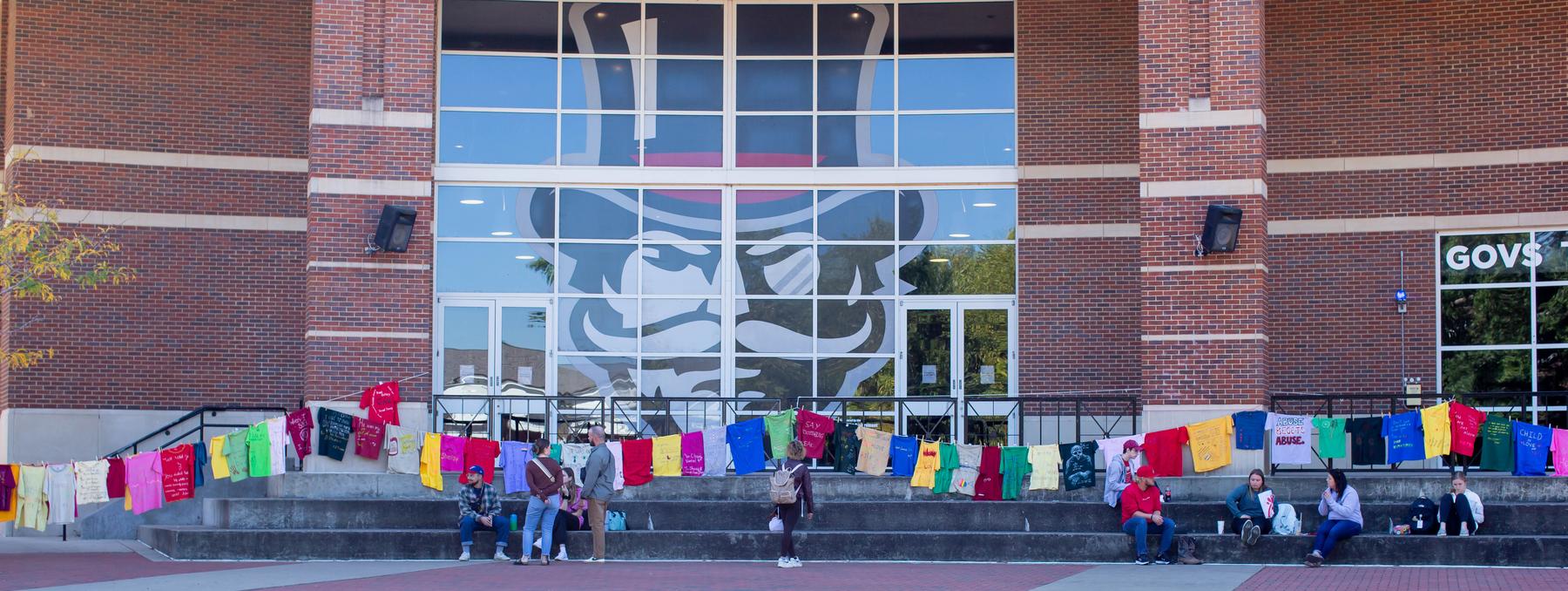 Austin Peay hosted the Clothesline Project on Wednesday, Oct. 5, to increase awareness of the impact of violence and abuse, honor survivors’ strength and give survivors an avenue to break the silence that often surrounds such violence.
Organizers dedicated the exhibition to Dr. Jill Eichhorn – a longtime professor at Austin Peay who died suddenly after a short illness on Oct. 2. As a sign at the exhibition noted, Eichhorn was a warrior for gender equality and nonviolence, and was a friend and adviser to all.
Donations were accepted in Eichhorn’s name to benefit the Legal Aid Society of Middle Tennessee.
The exhibition was hosted by Austin Peay’s Govs Care, and the Clarksville Area urban Ministries SafeHouse provided information about services for interpersonal violence survivors.