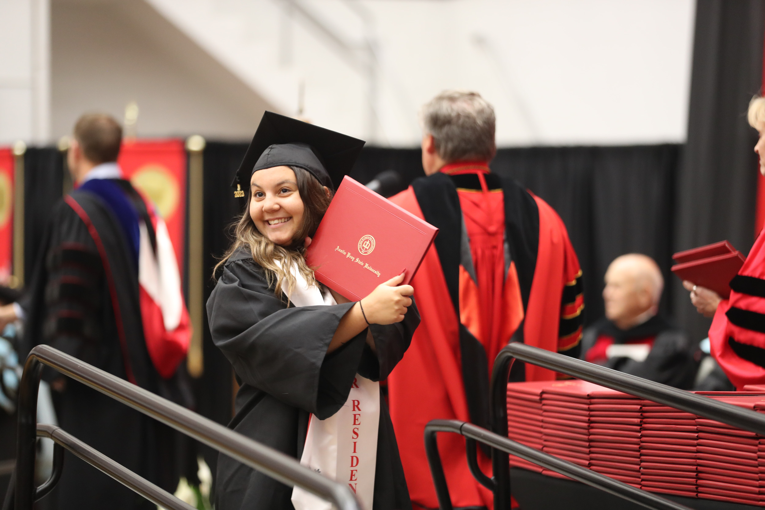 More than 600 students received degrees from Austin Peay State University this summer, and approximately 300 participated in a commencement ceremony hosted on Aug. 4 at the Dunn Center.
Undergraduate and graduate students from all five academic colleges and the new University College’s inaugural graduating class were recognized. A full recording of the ceremony is available through APSU-TV Clarksville’s YouTube Channel.
For more information about commencement, contact the Office of the Registrar at graduation@apsu.edu or 931-221-7150.