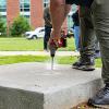 Preparing the concrete base for the sculpture.
