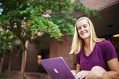 Student studies outside of Music Mass Communication building