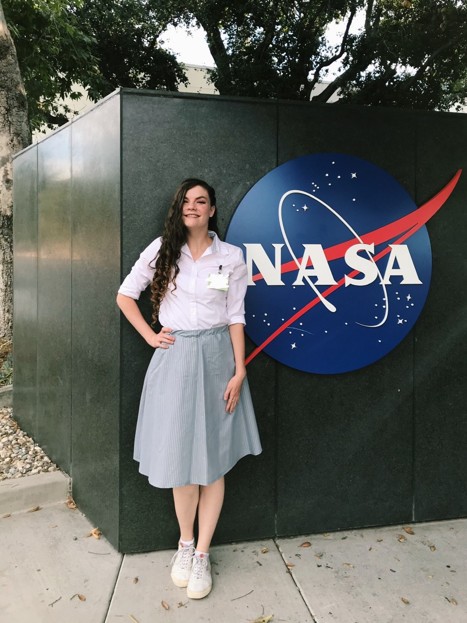 Deborah poses for photo outside of NASA