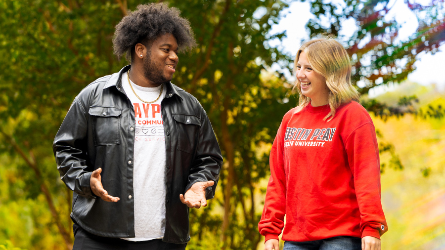 Students walking and talking on campus