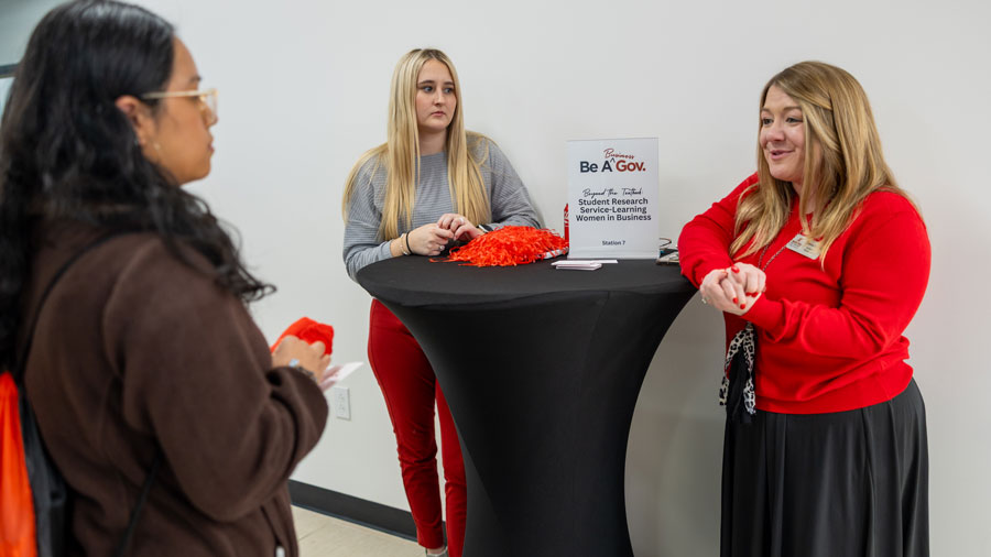 Student talking with a faculty member while visiting campus.