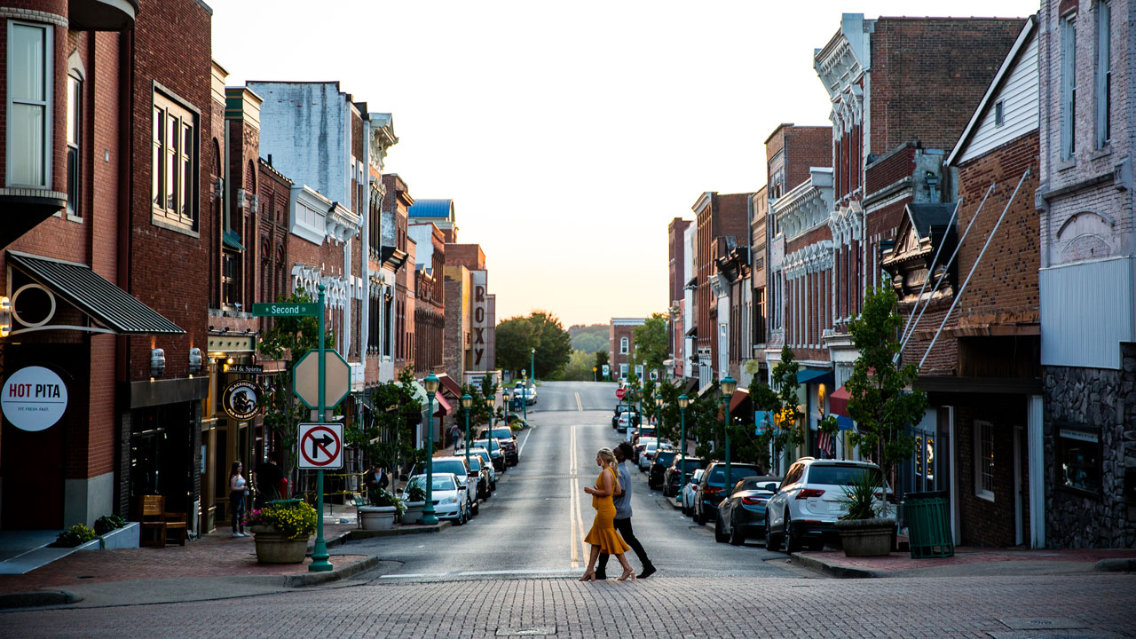 Shot of Franklin Street downtown with a couple crossing the street.