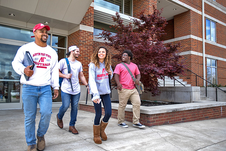 Students pose in housing quad