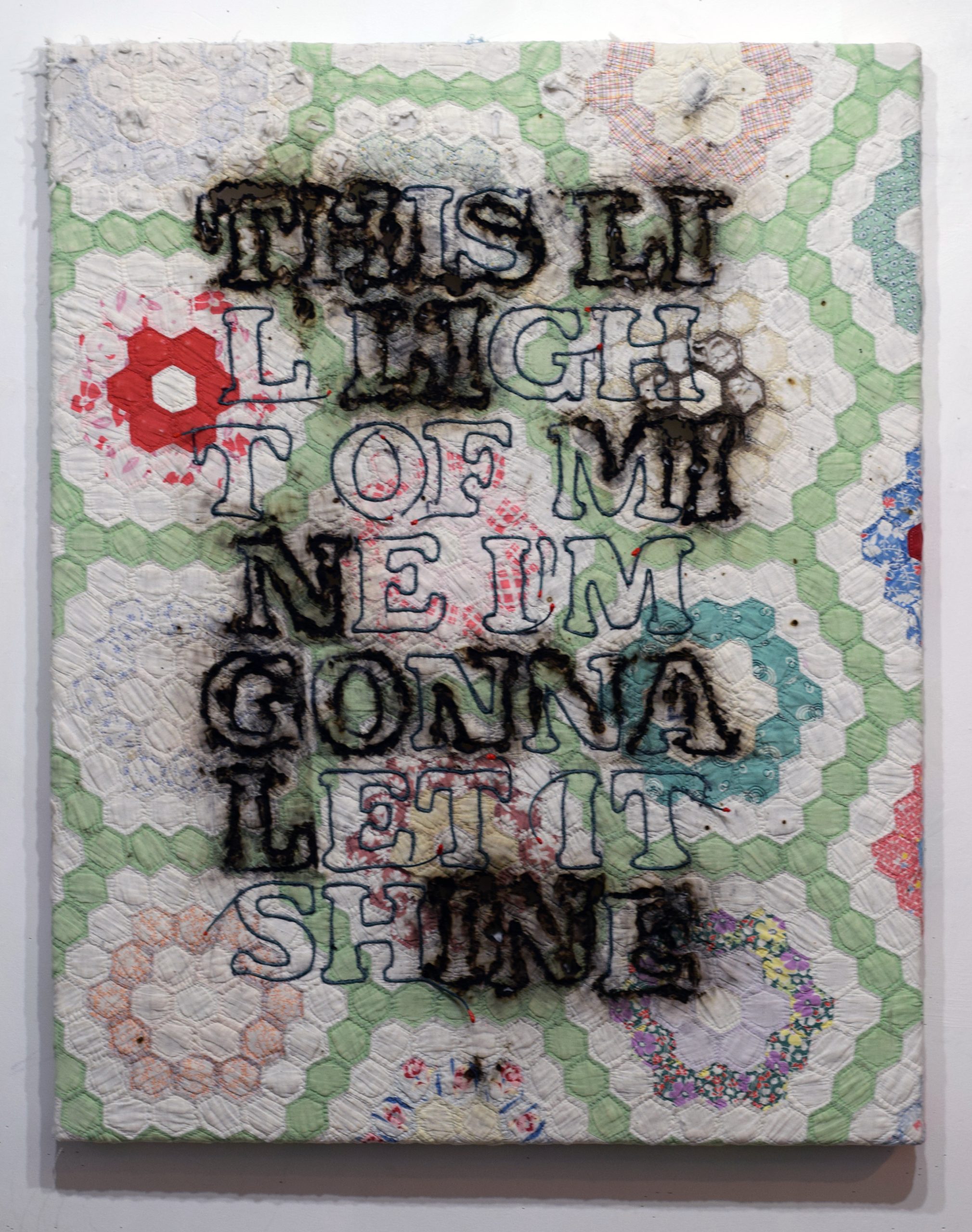 Harmening's textile art; quilt with words "this little light of mine."