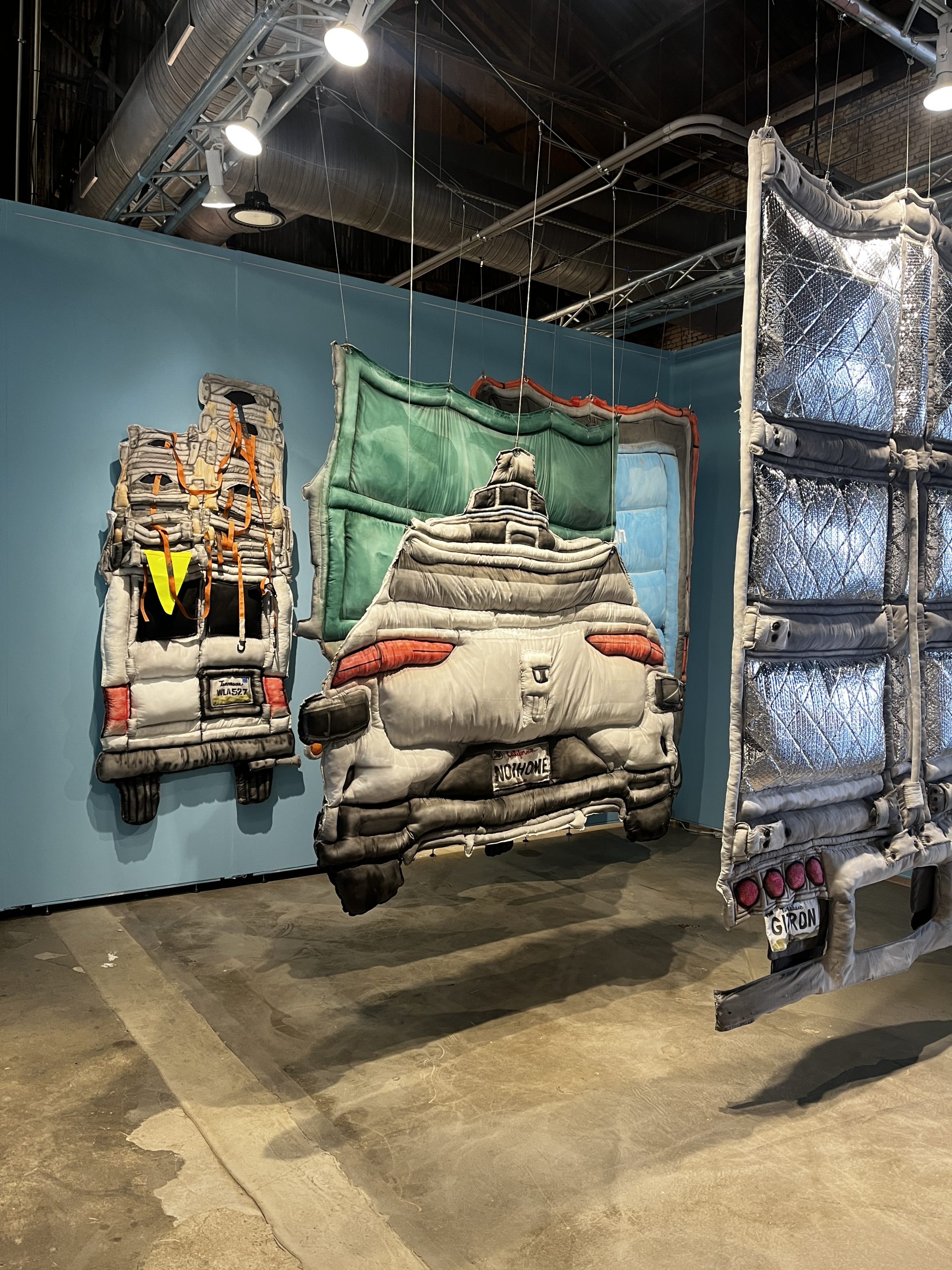 Harmening textile art; fabric vehicle.