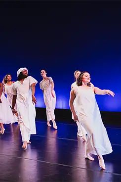 Students on stage during Spring Dance rehersal