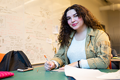 Student works at desk in Art and Design building