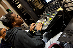 Student operates switchboard