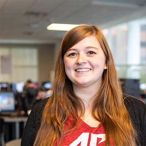 Student smiling at the camera