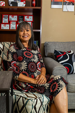 Yen Hoyt sitting in her office and looking at the camera.