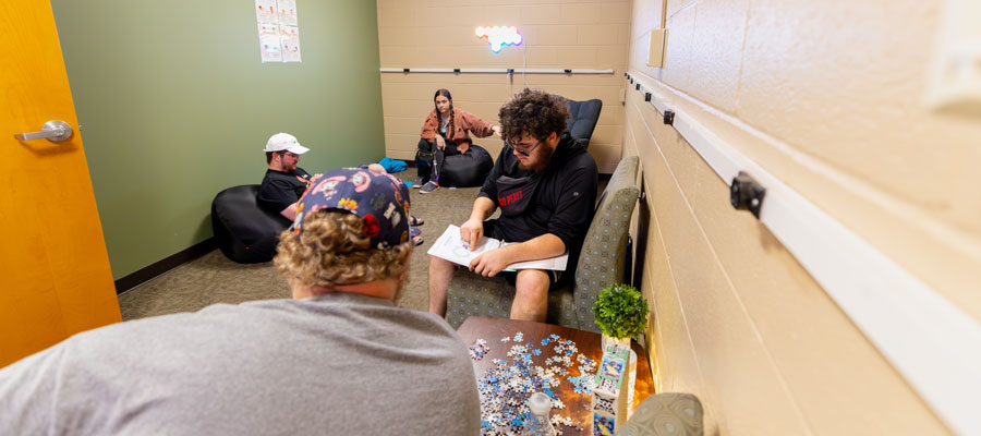 Students studying their book inside the study room.