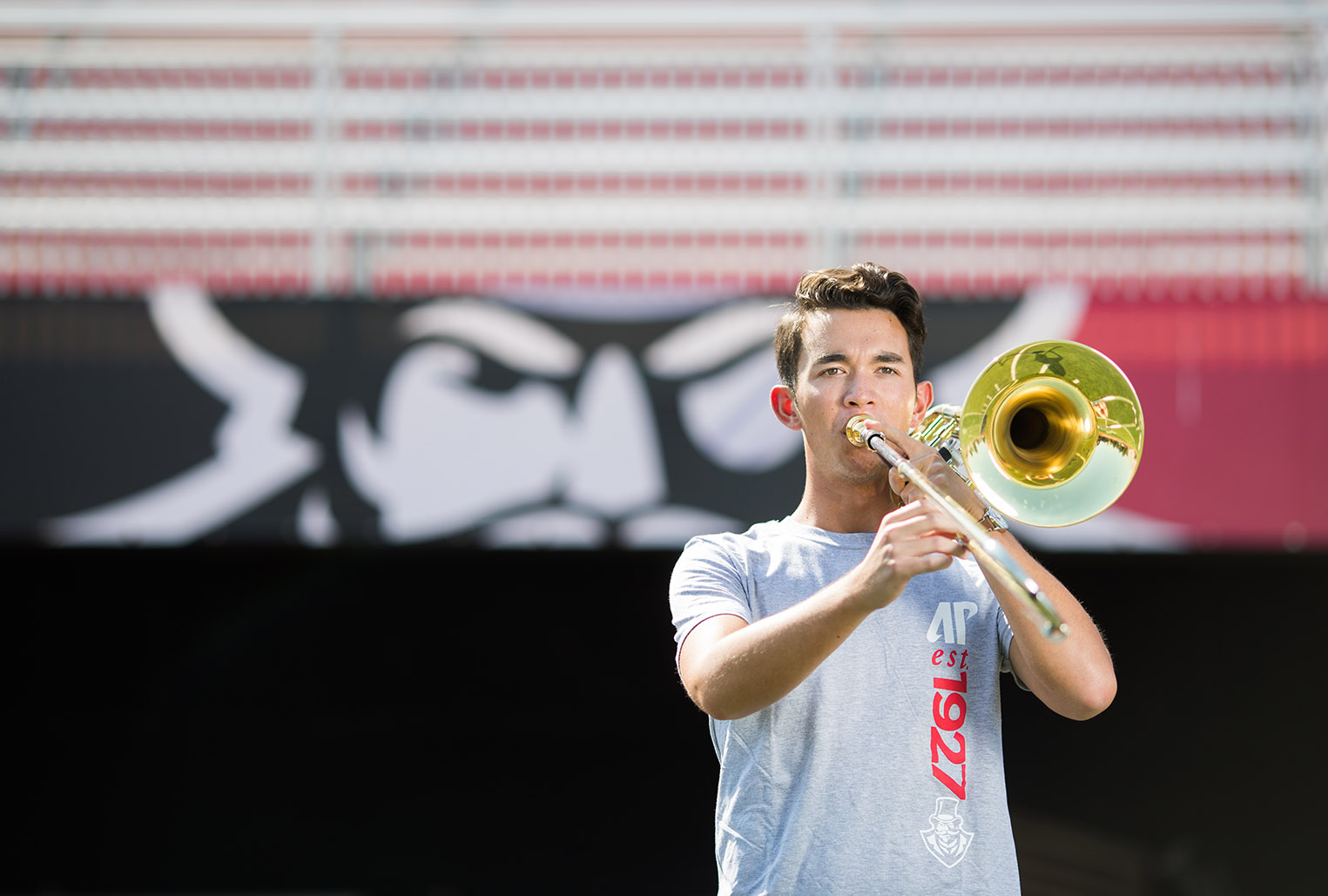 Garret Coscolluela playing instrument in stadium