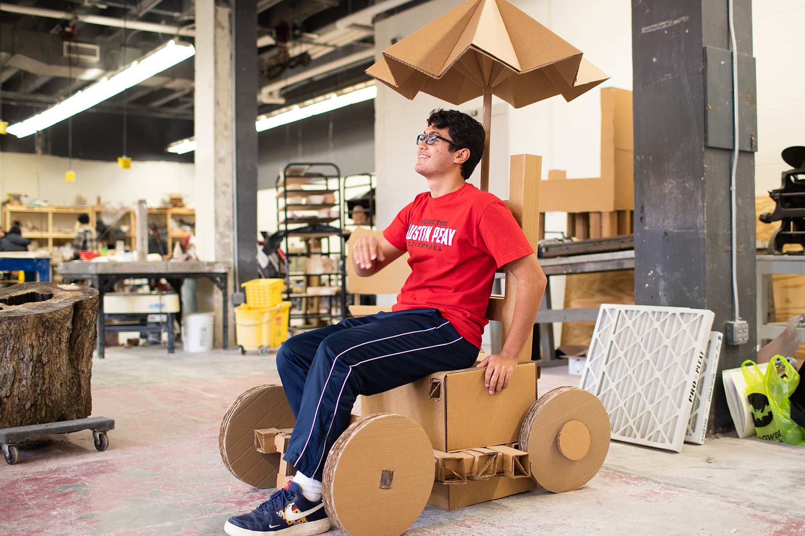Jeremy Vega poses in cardboard bicycle