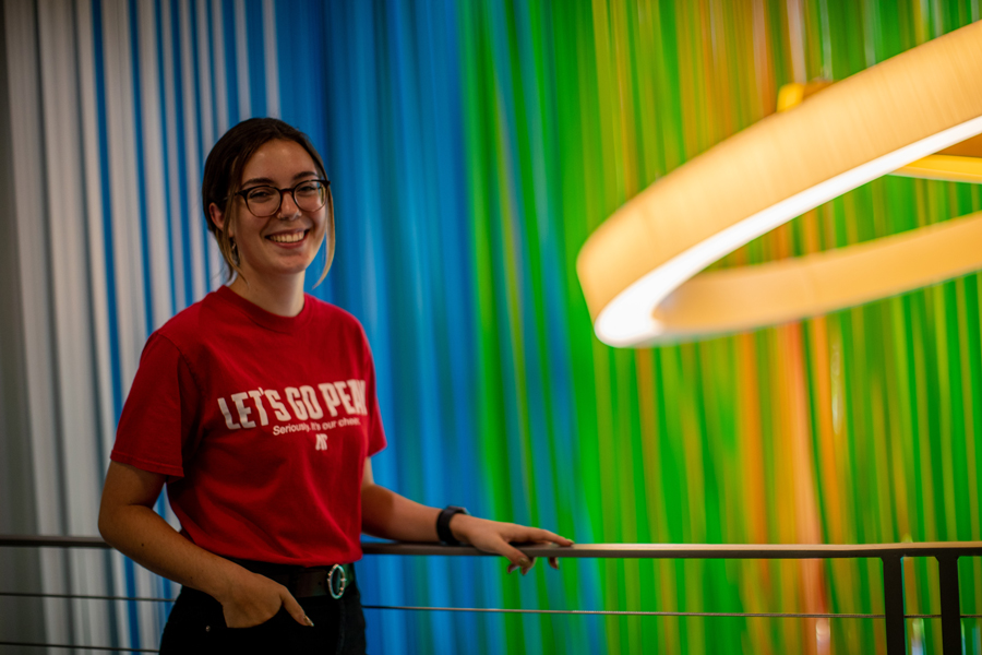 Katie Boyer infront of the light rings installation in the Art and Design Building.
