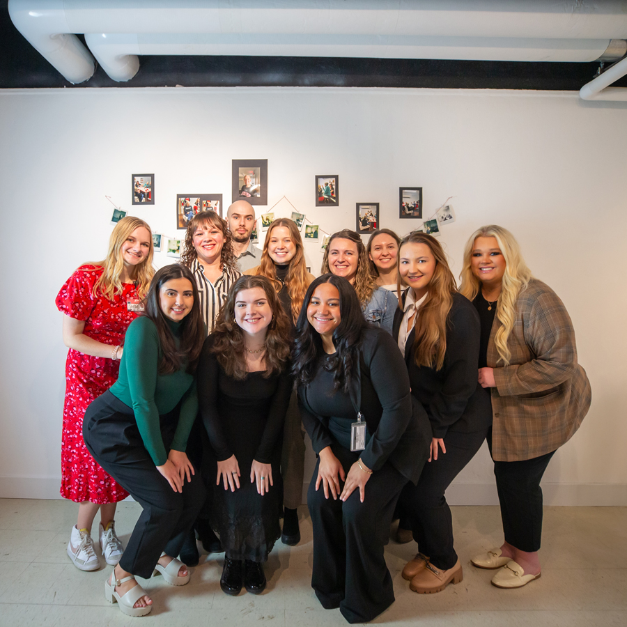 SLP Students posing in the gallery for a group photo