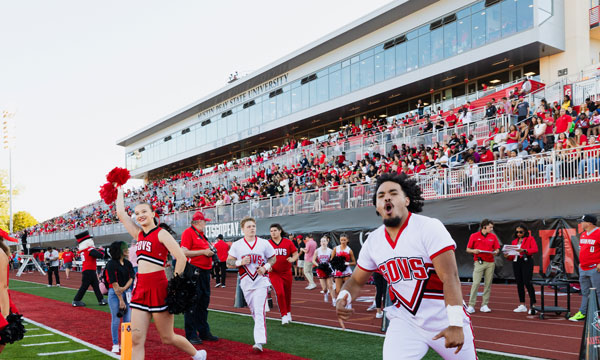 Chearleaders and the crowd cheering when APSU won at a home game.