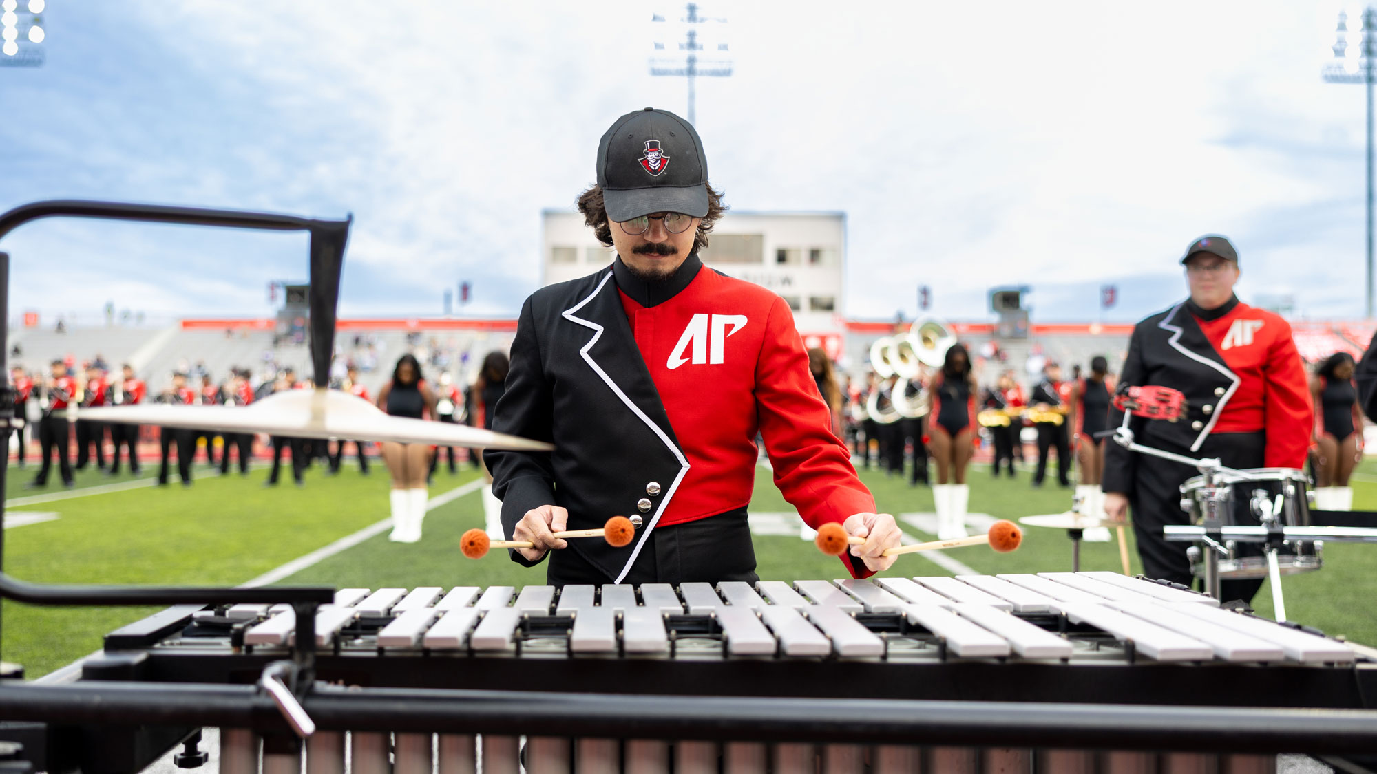 Perscussion band member playing the xylophone during the halftime show. 