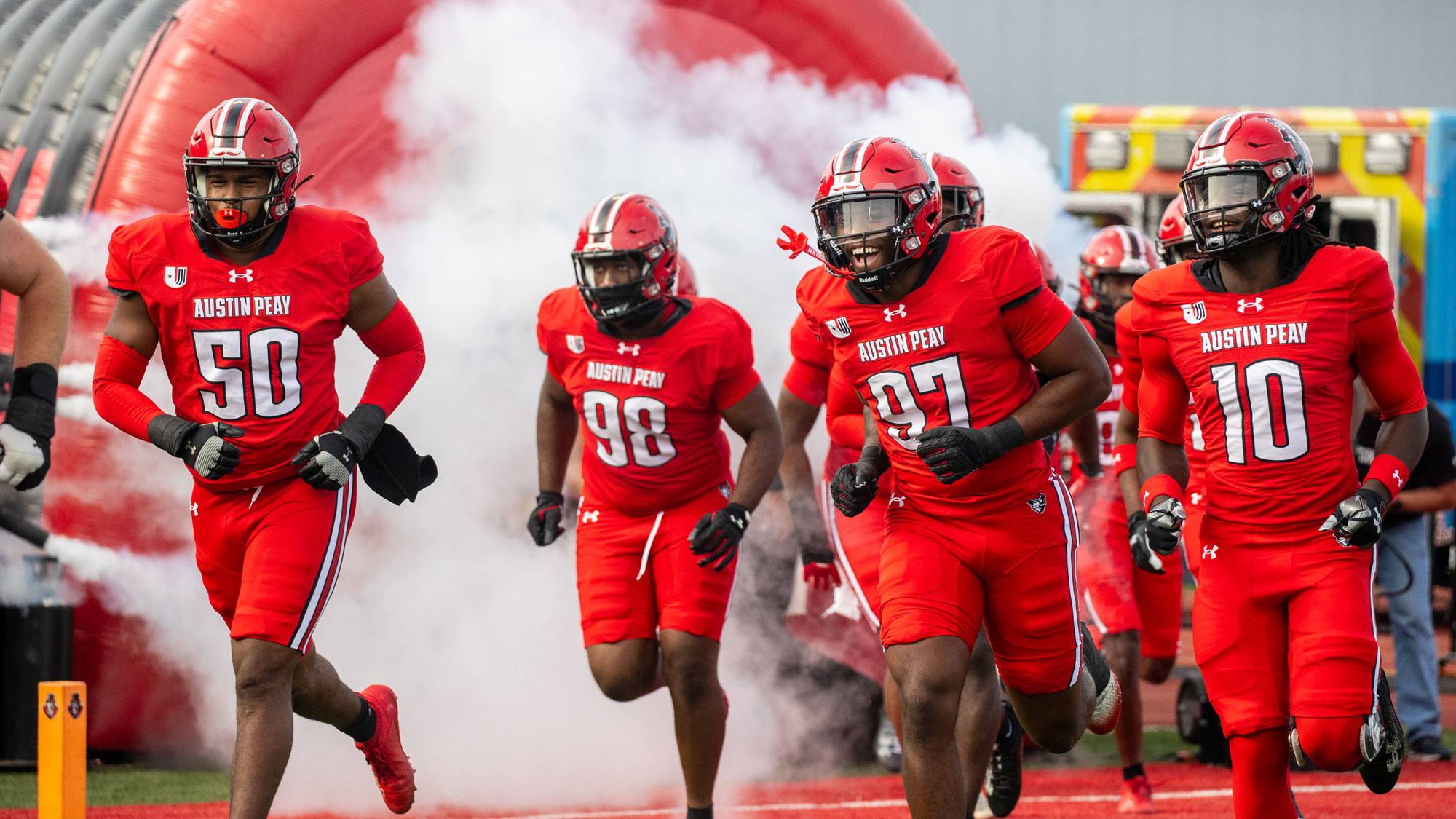 APSU Football players running onto the field before the game.