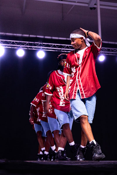 Students on stage performing a Step Show Routine