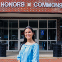 Picture of Alex Tetterton in front of the Honors Commons