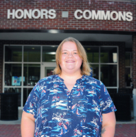 Picture of Julia Lewis in front of the Honors Commons