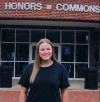 Picture of Kylee Hall in front of the Honors Commons